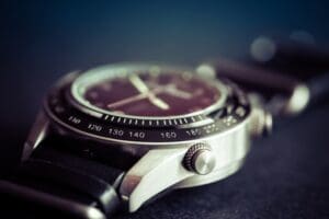 A close up of the wrist watch on a table