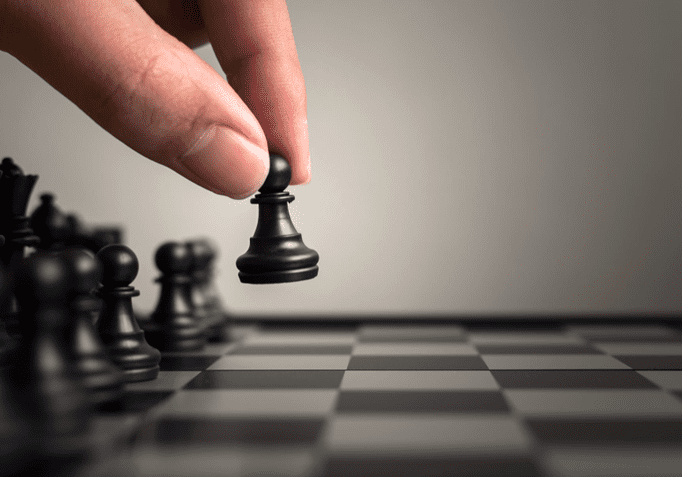 A person playing chess on the board