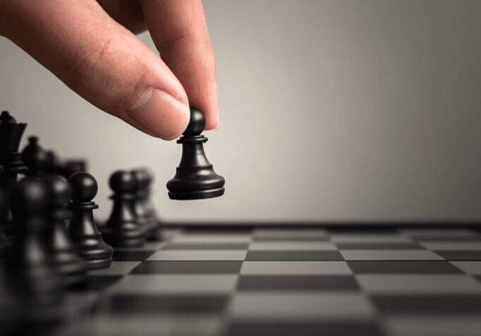 A person playing chess on the board