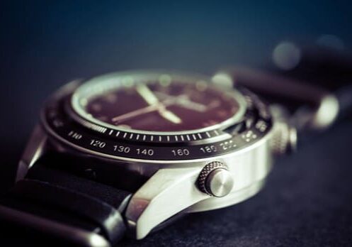 A close up of the wrist watch on a table